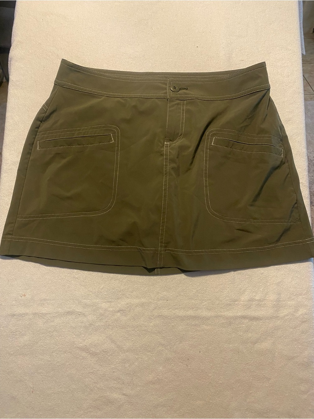 prAna Lena Skort features a buttoned waist and prominent utility front poc. Med